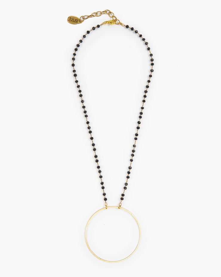 Booster, Julio Designs, Frisco, TX, Delicate brass circle is suspended from delicate micro crystal chain