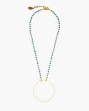 Frisco, TX Delicate brass circle is suspended from delicate micro crystal chain. Booster, Julio Designs