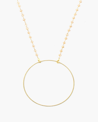 Delicate brass circle is suspended from delicate micro crystal chain. Booster, Julio Designs, Frisco, TX