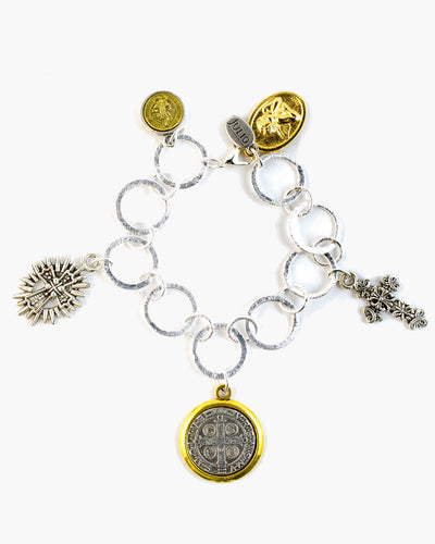 Two-tone St. Benedict, cross and saint charms are suspended from brushed silver open link chain.  The Deacon Bracelet adds fun to every outfit. Frisco TX, Julio Designs