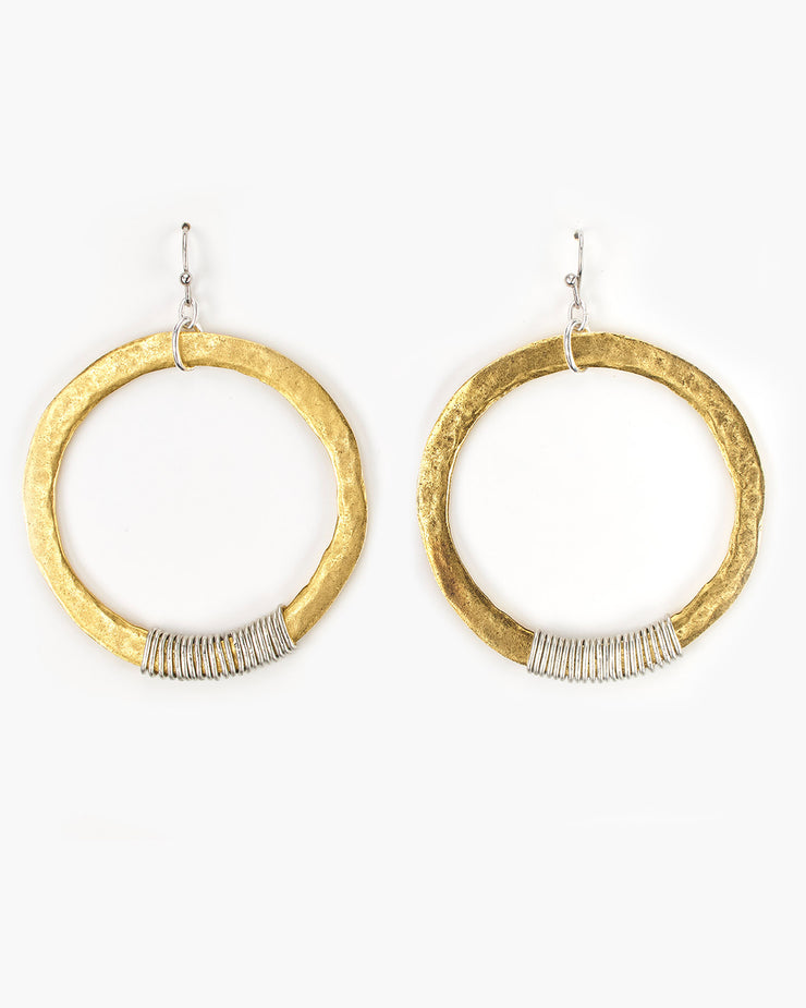 Our large hammered circles with a hand wire-wrapped accent. Mixed metal beauty! For the smaller version see our ER271. Wire Wrapped Large Hoop Earring (ER272) Handmade in Frisco TX, Julio Designs