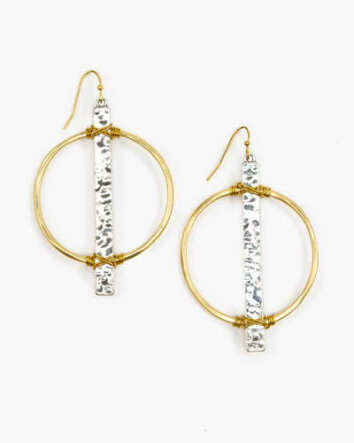 Handmade in Frisco TX, Julio Designs Beautifully wire wrapped hammered bar on metal circle earring. This earring will quickly become one of your favorites.