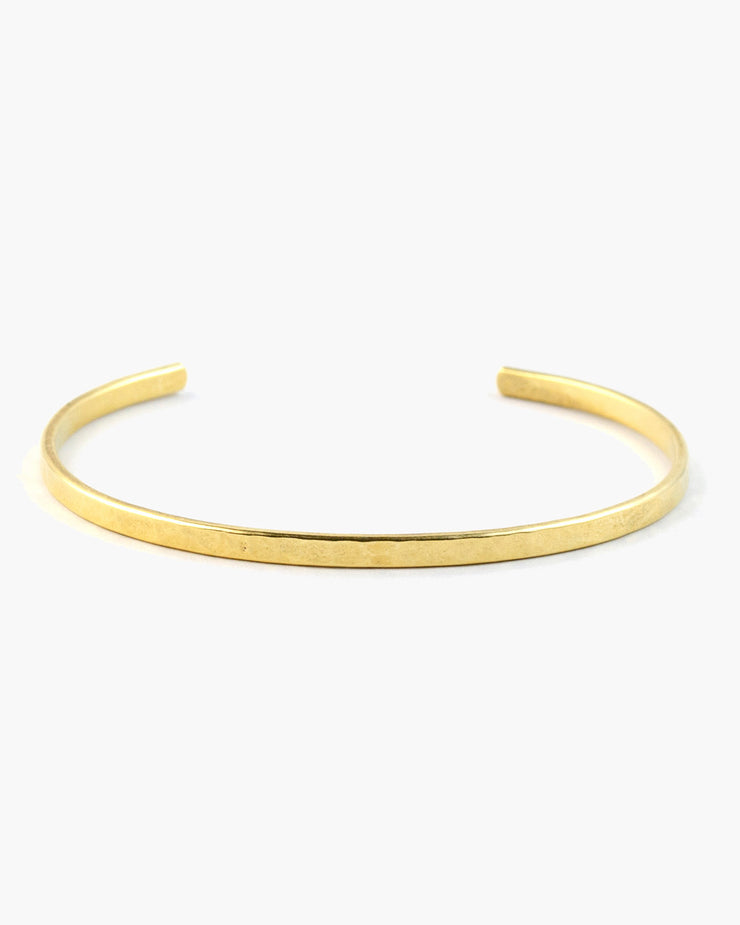 Hammered narrow cuff bracelet, the Fine Line Cuff Bracelet is the basis for every great bracelet stack.  A subtle statement alone, or a slender shine when mixed in with other bracelets