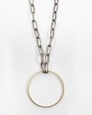A brass circle is suspended from paperclip chain.  Beautiful on its own or layered, the Kit Kat Necklace is sure to become one of your go-to favorites. Kit Kat Paperclip Chain Circle Necklace
