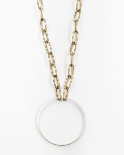 A brass circle is suspended from paperclip chain. Beautiful on its own or layered, the Kit Kat Necklace is sure to become one of your go-to favorites. Kit Kat Paperclip Chain Circle Necklace