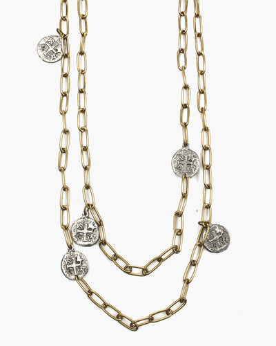 A gold or silver plated coin that is suspended from paperclip chain. Beautiful on its own or layered. The necklace can be doubled or tripled. Marjoram Long Paper Clip Chain Coin Necklace, Handmade in Frisco TX, Julio Designs