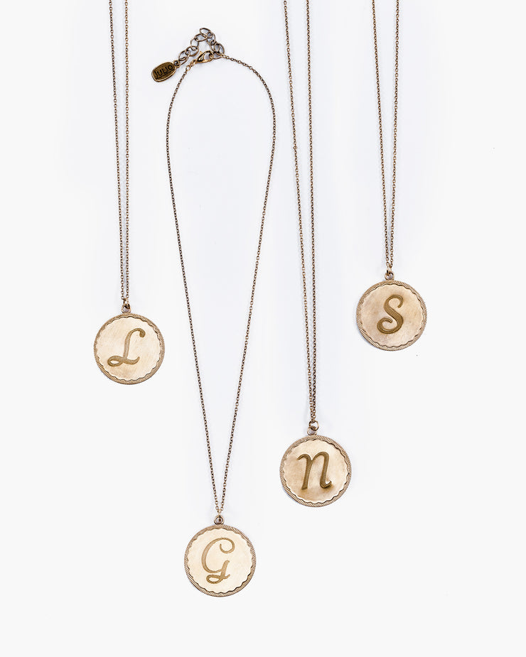 Uppercase monogram medallion on gold baby chain.  Express yourself with one of our favorite initial necklaces, Nestle. Nestle Initial Monogram Pendant Necklace, handmade in Frisco TX, Julio Designs