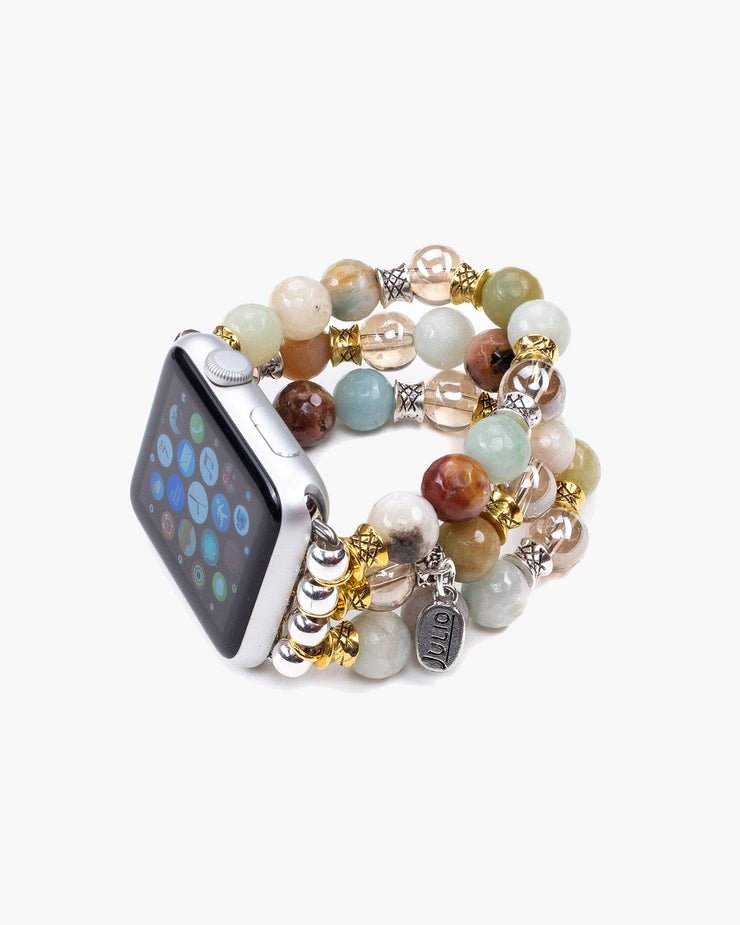 Triple strand watchband of gemstones, Czech crystals and metal spacers on stretch cord for your Apple watch. The Tinker  Apple Watchband is sized to fit an average 7" wrist, but can be ordered shorter or longer. Julio Designs, Handmade in Frisco TX Brackets are 38mm but will fit 42mm watch faces.